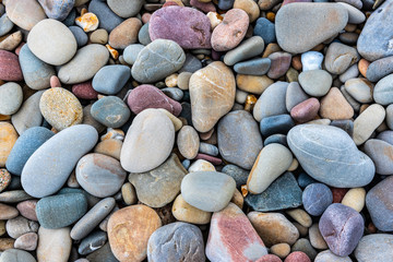 Multicolored pebbles on a beach