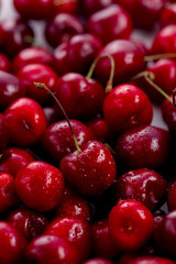 Cherries with water drops close-up. Macro berries shot with copy space