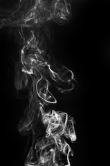 abstract beautiful fragment movement of burn white smoke on black background.