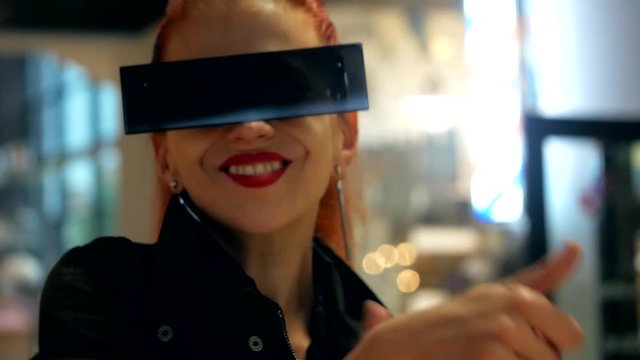 Red hair pretty fashion woman with stylish sunglasses has a fun and smiling in indoor close-up