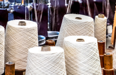 Traditional wool reels of the british waving and textile industry