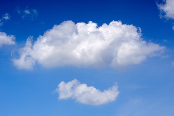 Naklejka na ściany i meble Beautiful fluffy clouds in the blue sky.