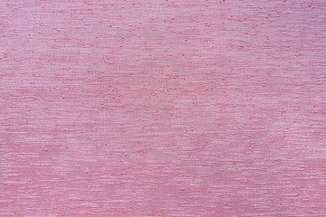 Pink cloth background.