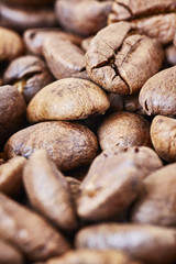 Close up picture of freshly roasted coffee beans, shallow depth of field.