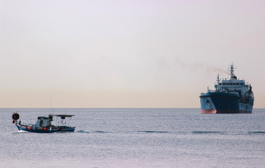 breakwater, and ships on the horizon.