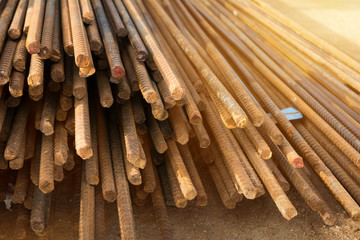 Rusty steel bar or steel reinforcement bar texture in construction site with sunlight