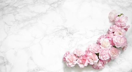 Flowers composition. Frame made of carnations on marble background. Flat lay, top view