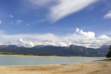 A buoy lies on the gravel at the bottom of the dried-up reservoir