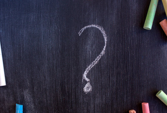 chalk board and chalk. School board for records. A drawing on a black background with colored crayons