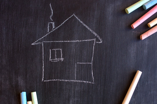 chalk board and chalk. School board for records. A drawing on a black background with colored crayons