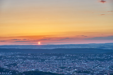 Naklejka na ściany i meble Sunset over Stuttgart City in Germany / View from the first TV Tower in the world