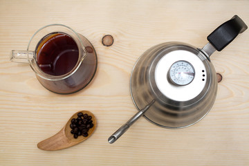 Coffee drip from steaming filter drip style on the table. 