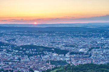 Fototapeta na wymiar Sunset over Stuttgart City in Germany / View from the first TV Tower in the world