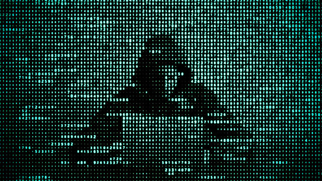 Hacker in data security concept. Hacker using laptop. Hacking the Internet. Cyber attack.