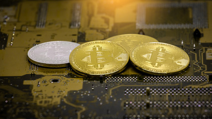 Cryptocurrency Bitcoin on a Motherboard.