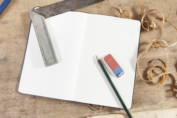 blank notebook on carpeters table