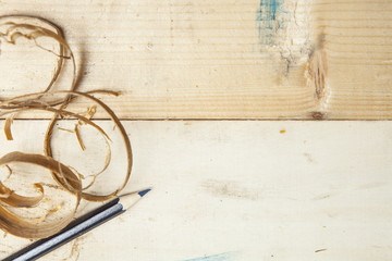 pen and sawdust on wooden board. carpentry