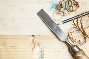 chisel an sawdust on wooden board.copy space