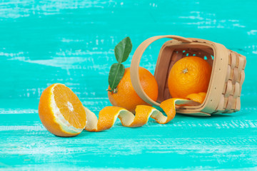 orange fruit on color table background.