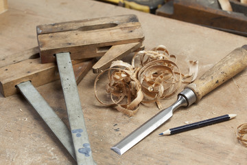 chisel an sawdust on wooden board.copy space