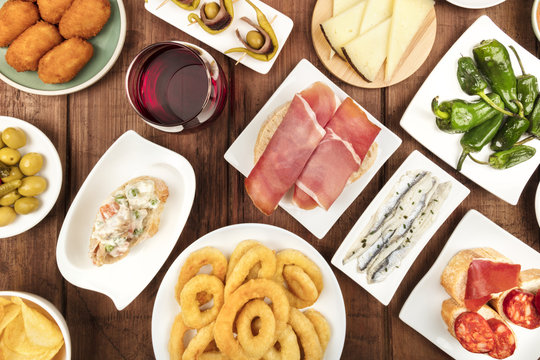 Spanish food. Overhead photo of many different tapas with wine