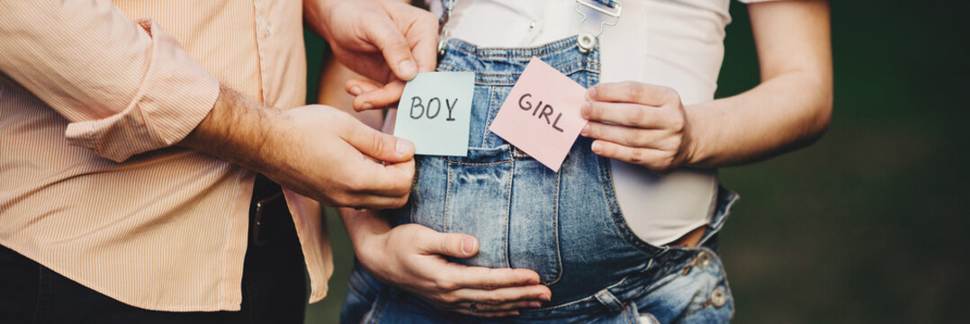 Baby Gender. Mom And Dad With BOY And GIRL Cards