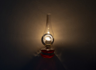 Old oil lamp on the wall