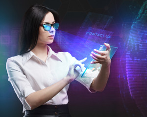 The concept of business, technology, the Internet and the network. A young entrepreneur working on a virtual screen of the future and sees the inscription: Contact us