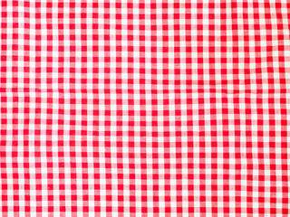 Top view of red and white plaid picnic tablecloth