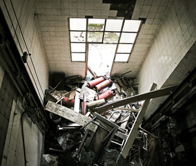 Fire extinguisher and trash in a broken lift