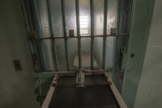High risk solitary confinement cell in prison through bars