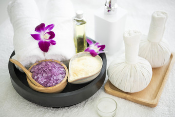 Obraz na płótnie Canvas Spa accessories aromatic salt scrub and towel, compress ball.