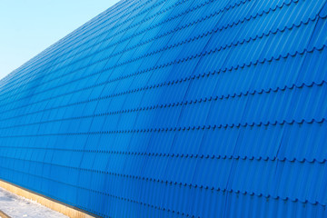 Perspective of the hangar wall from blue tile