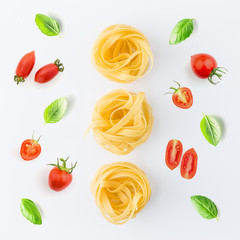 Pasta and ingredients on white background from top view. Italian food concept.