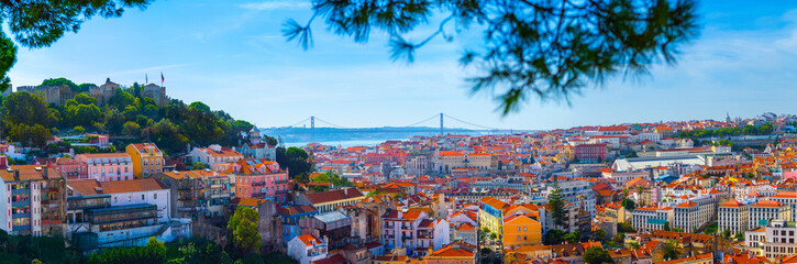 Summertime sunshine day cityscape panoramic view of town, Sao Jorge Castle, and all historic old...