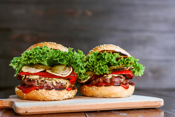 delicious homemade burger with juicy meatball and grilled vegetables