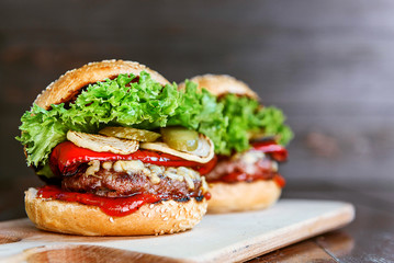 delicious homemade burger with juicy meatball and grilled vegetables