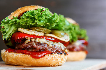 delicious homemade burger with juicy meatball and grilled vegetables