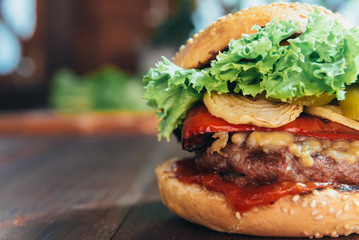 delicious homemade burger with juicy meatball and grilled vegetables
