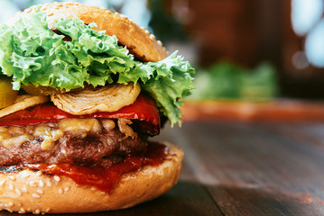delicious homemade burger with juicy meatball and grilled vegetables