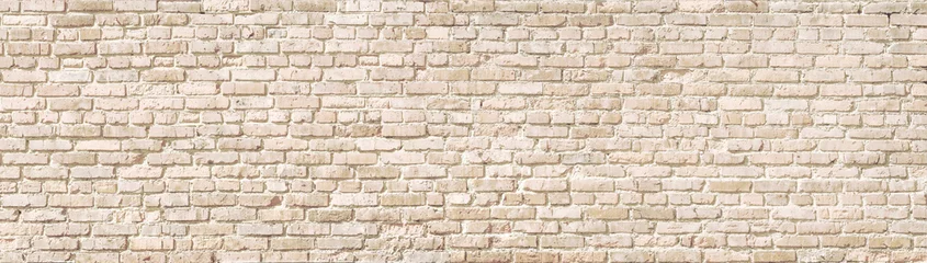 Papier Peint photo Lavable Mur de briques Panorama de mur de briques anciennes beiges.