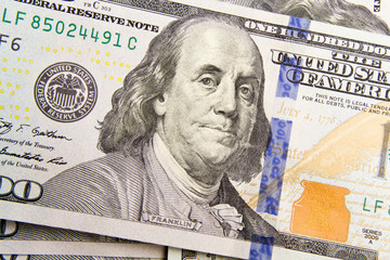 Front of the one hundred dollar bill with a Portrait of President Benjamin Franklin's close-up