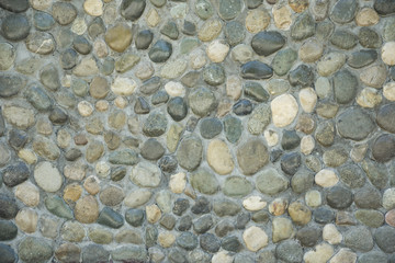 texture of a wall made of sea stones, a seaport castle