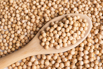 dry raw chickpeas in a spoon