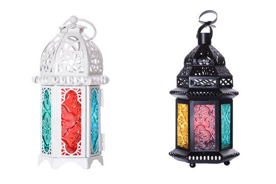 Two traditional lamps from Morocco white and black with colored glasses isolated on white background