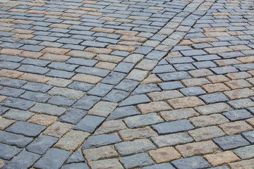 Old cobblestone pavement close-up.