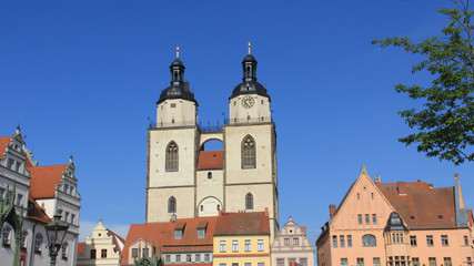 Fototapeta na wymiar Colorful City View And Twins Tower Of Town Church In Wittenberg Germany