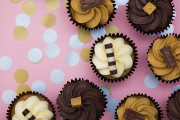 Cupcakes decorated with chocolate,caramel and vanilla icing