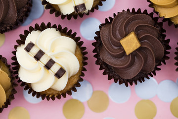 Cupcakes decorated with chocolate,caramel and vanilla icing