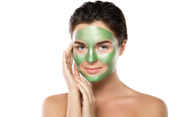 Woman with green peel-off mask on her face